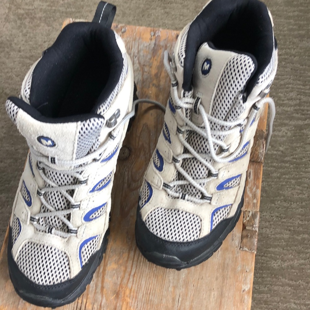 Pair of Merrell high top boots. Lightweight tan suede with some blue accents